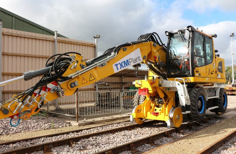 TXM Plant Hire vehicle working on railway