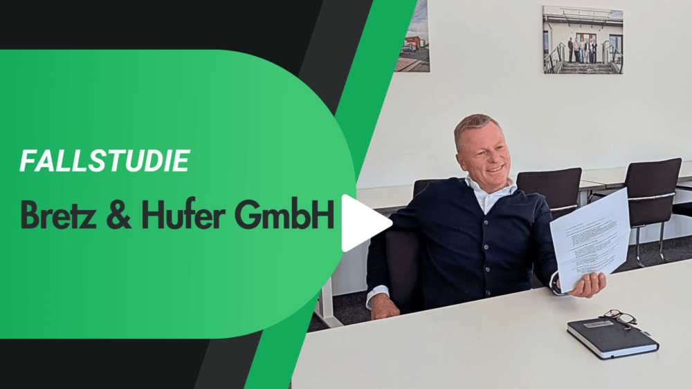 A man in business attire sits at a conference table, smiling while holding papers. Text reads: "Fallstudie Bretz & Hufer GmbH.