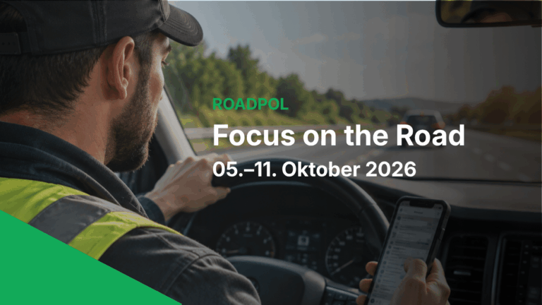 A man driving a car looks at his phone while holding the steering wheel, distracted from the task at hand. Text overlay reads: “ROADPOL Focus on the Road 05.–11. Oktober 2026.”.